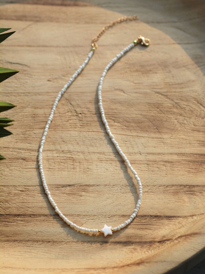 Collier ras-de-cou perles blanches et étoile nacrée – CXL by Christian Lacroix