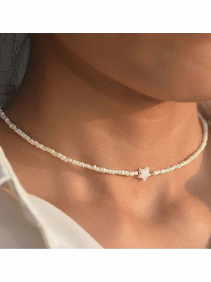 Collier ras-de-cou perles blanches et étoile nacrée – CXL by Christian Lacroix