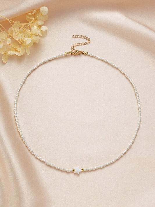 Collier ras-de-cou perles blanches et étoile nacrée – CXL by Christian Lacroix
